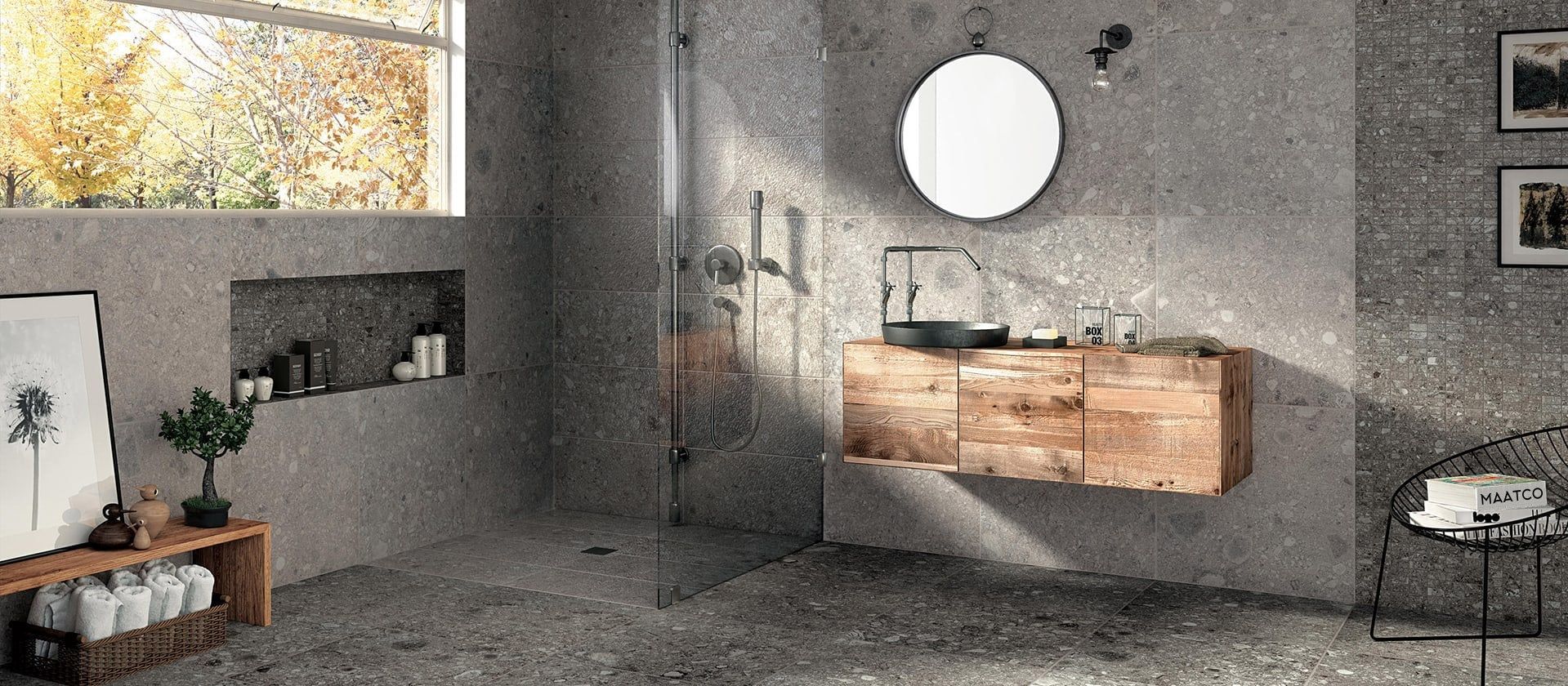 Renovated modern bathroom with glass shower and wood vanity